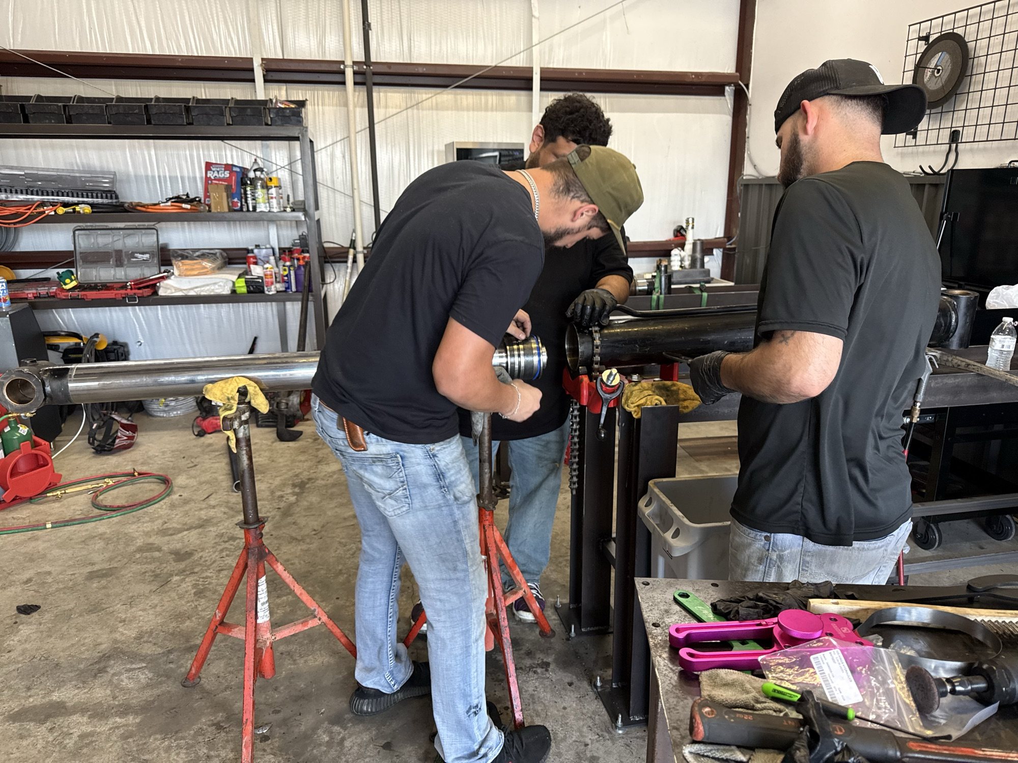 Kings Hydraulics technicians working on a hydraulic cylinder